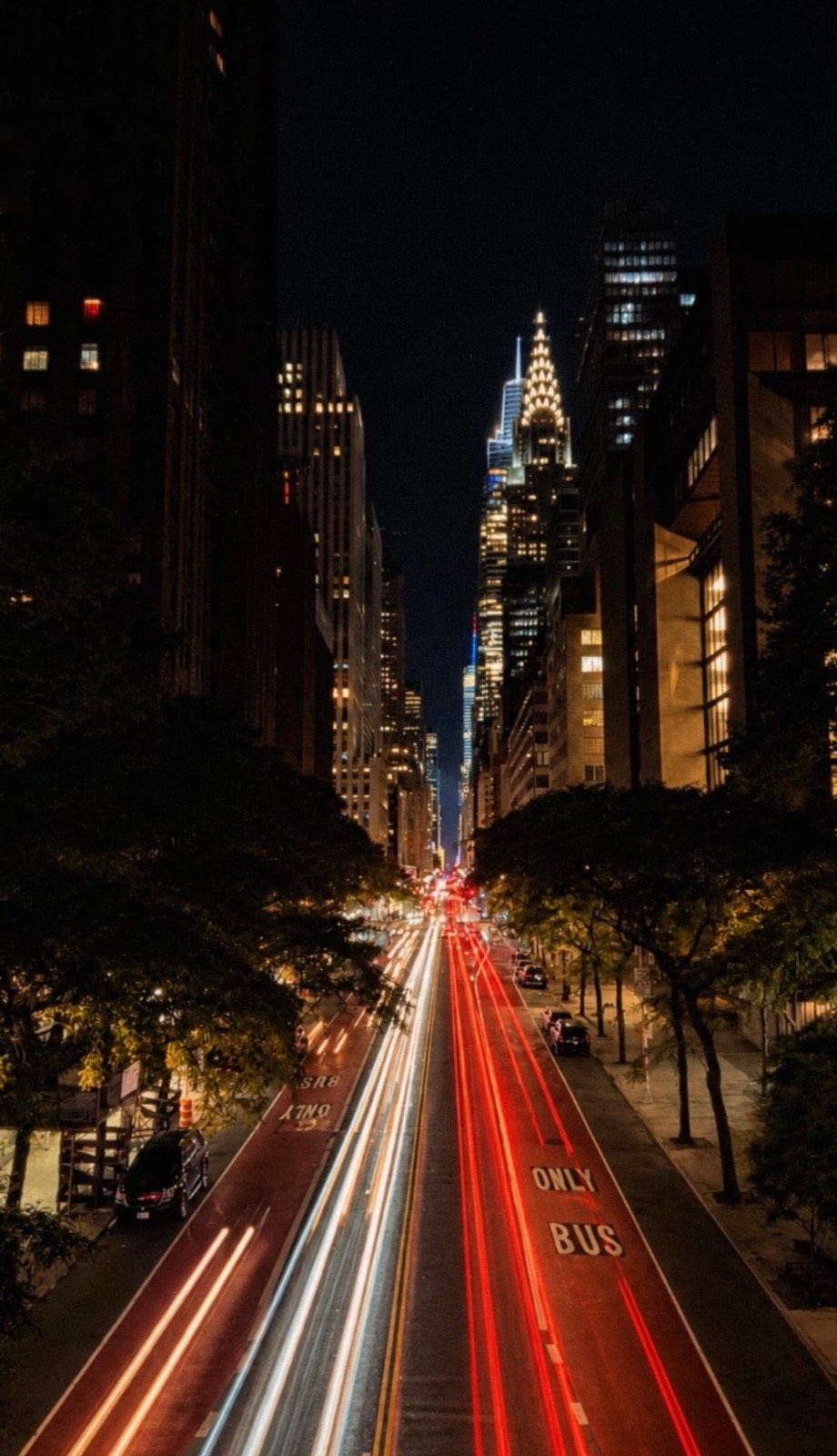 City skyline at night, light trails